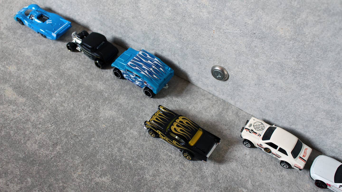 A demonstration of parallel parking using Hot Wheels cars.